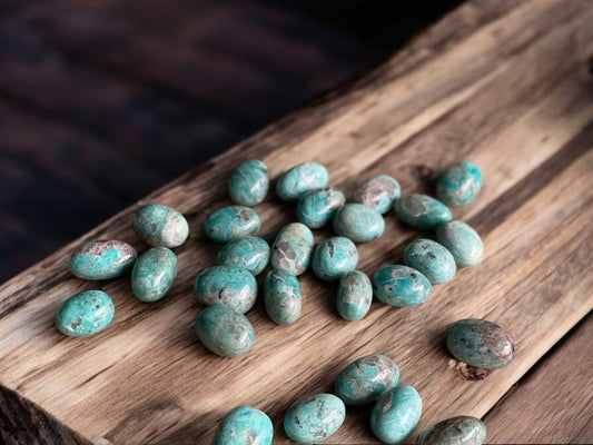 Amazonite tumbled crystals on a slab