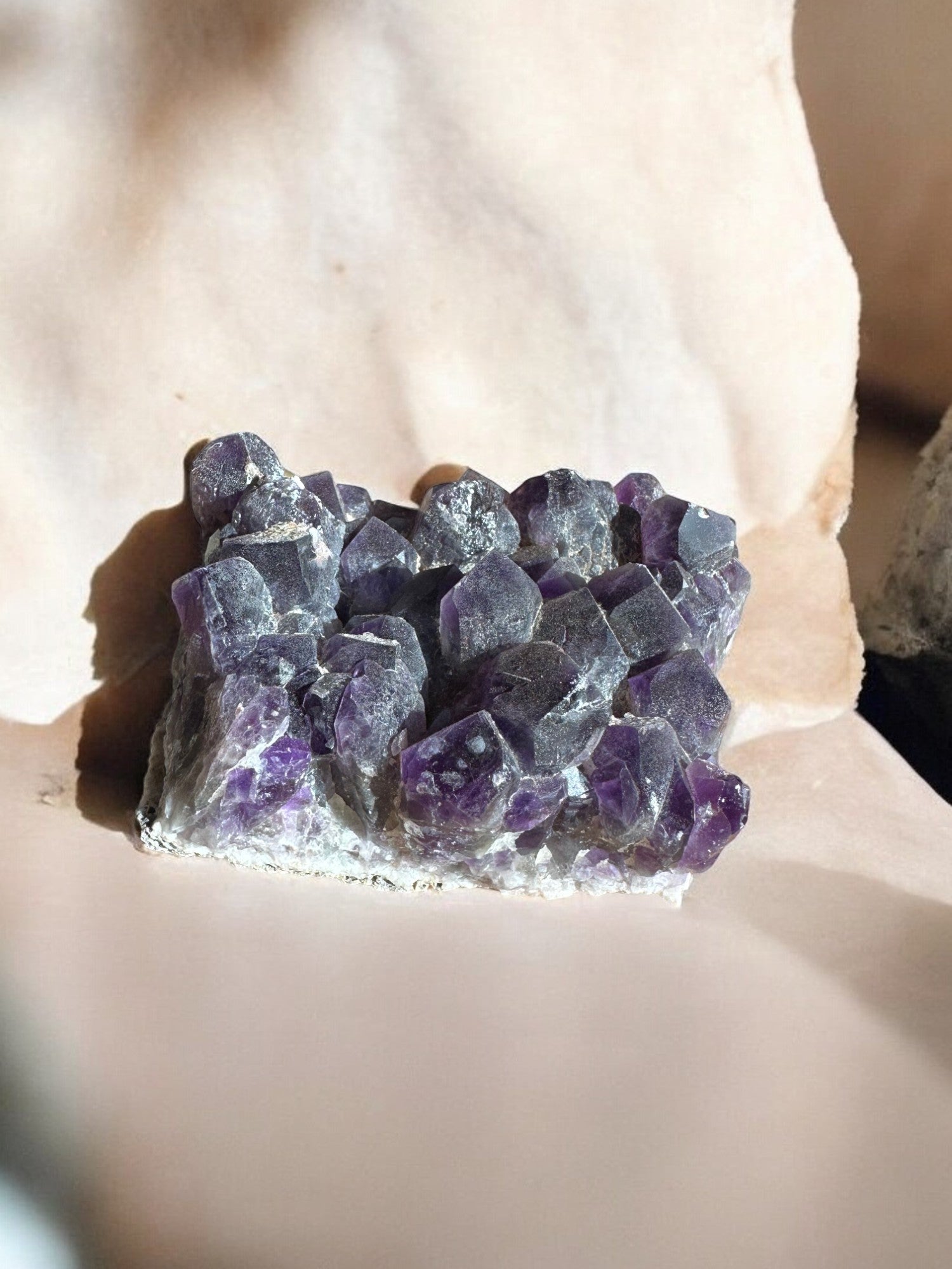 Amethyst raw crystal on sunlight