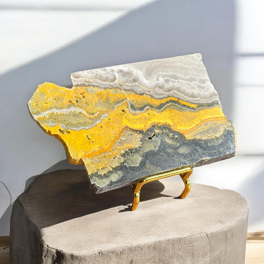 bumblebee jasper crystal slab on a stand