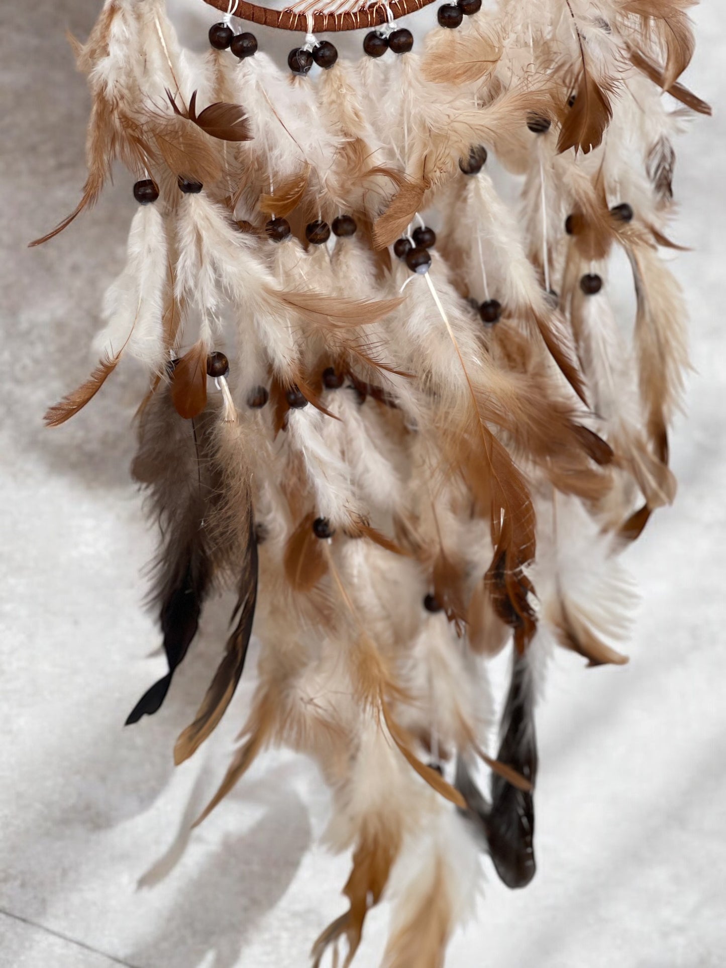 Citrine crystal dreamcatcher with brown feathers