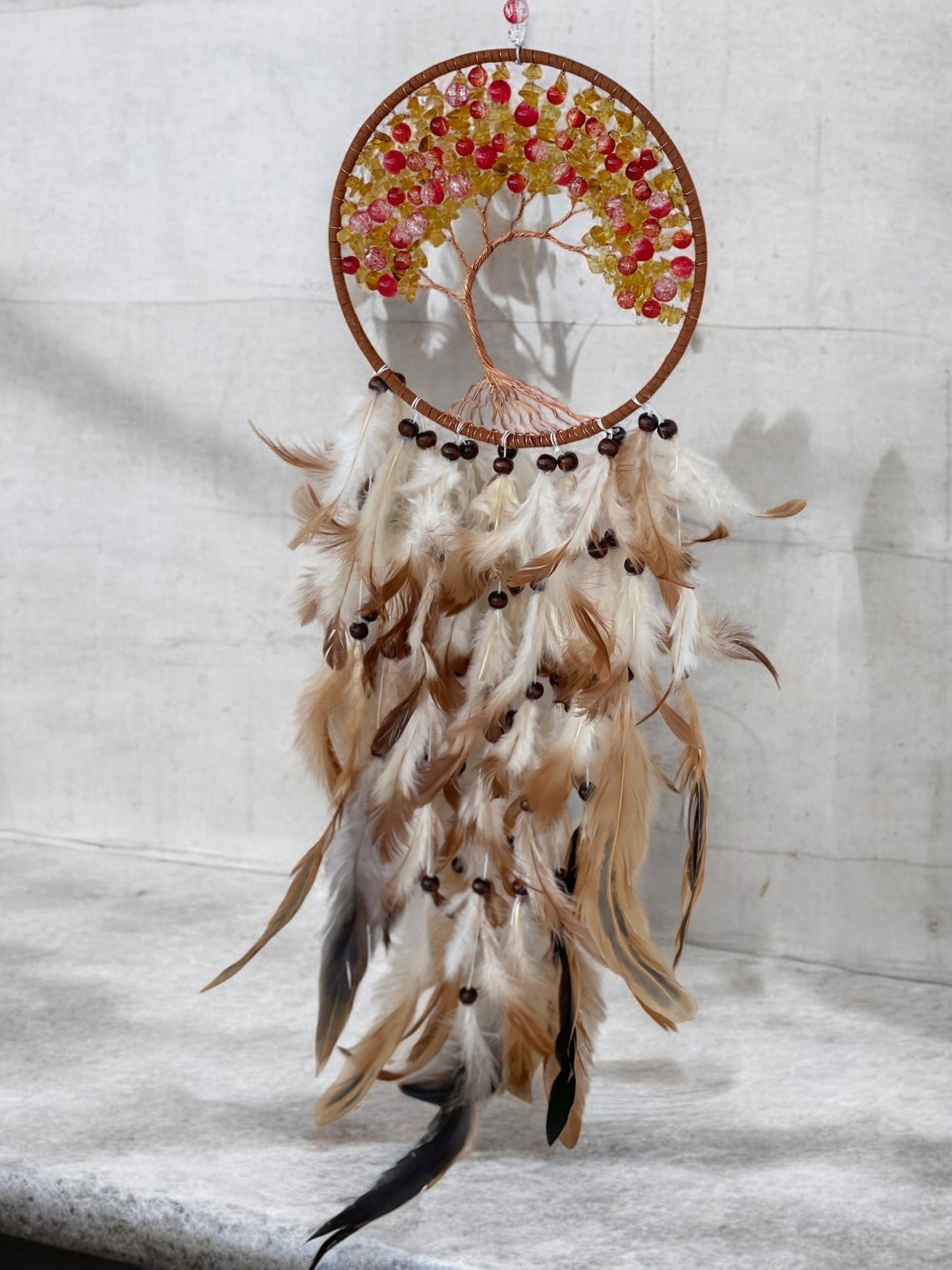 Citrine crystal dreamcatcher hanging on a wall