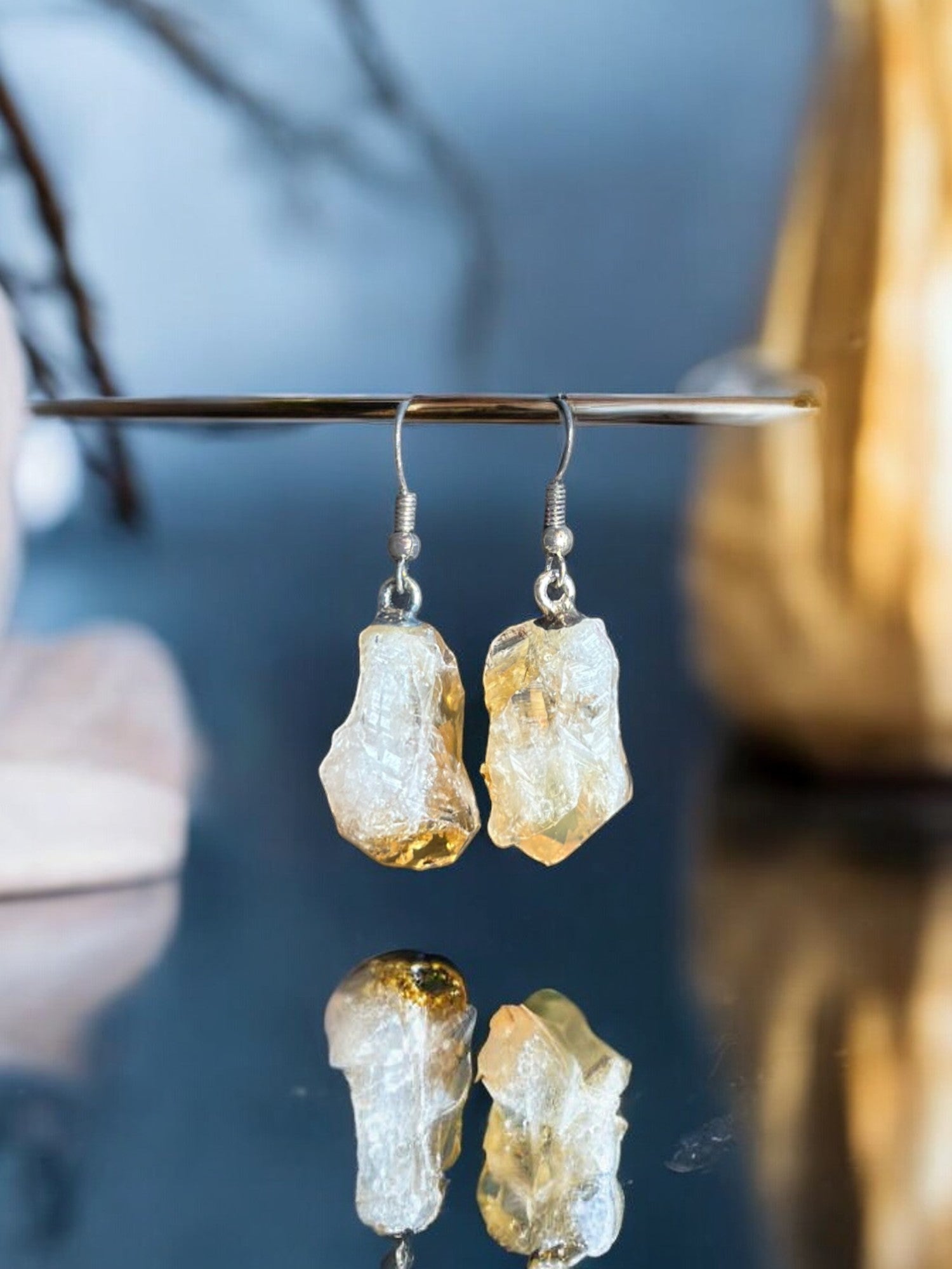 Citrine crystal earrings hanging on