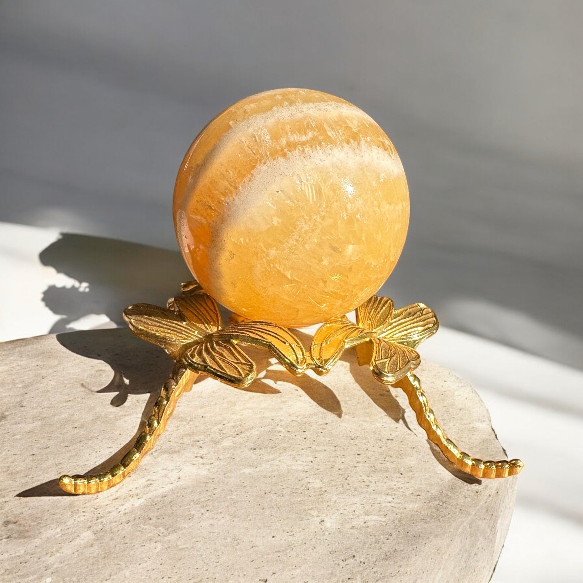 Orange calcite crystal ball