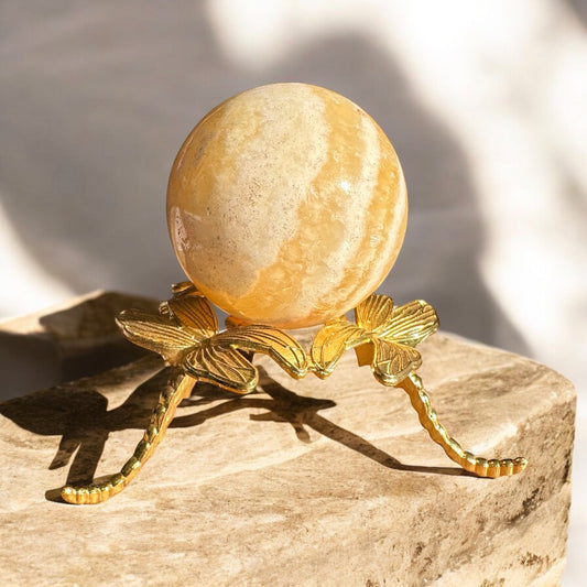 Orange calcite crystal sphere