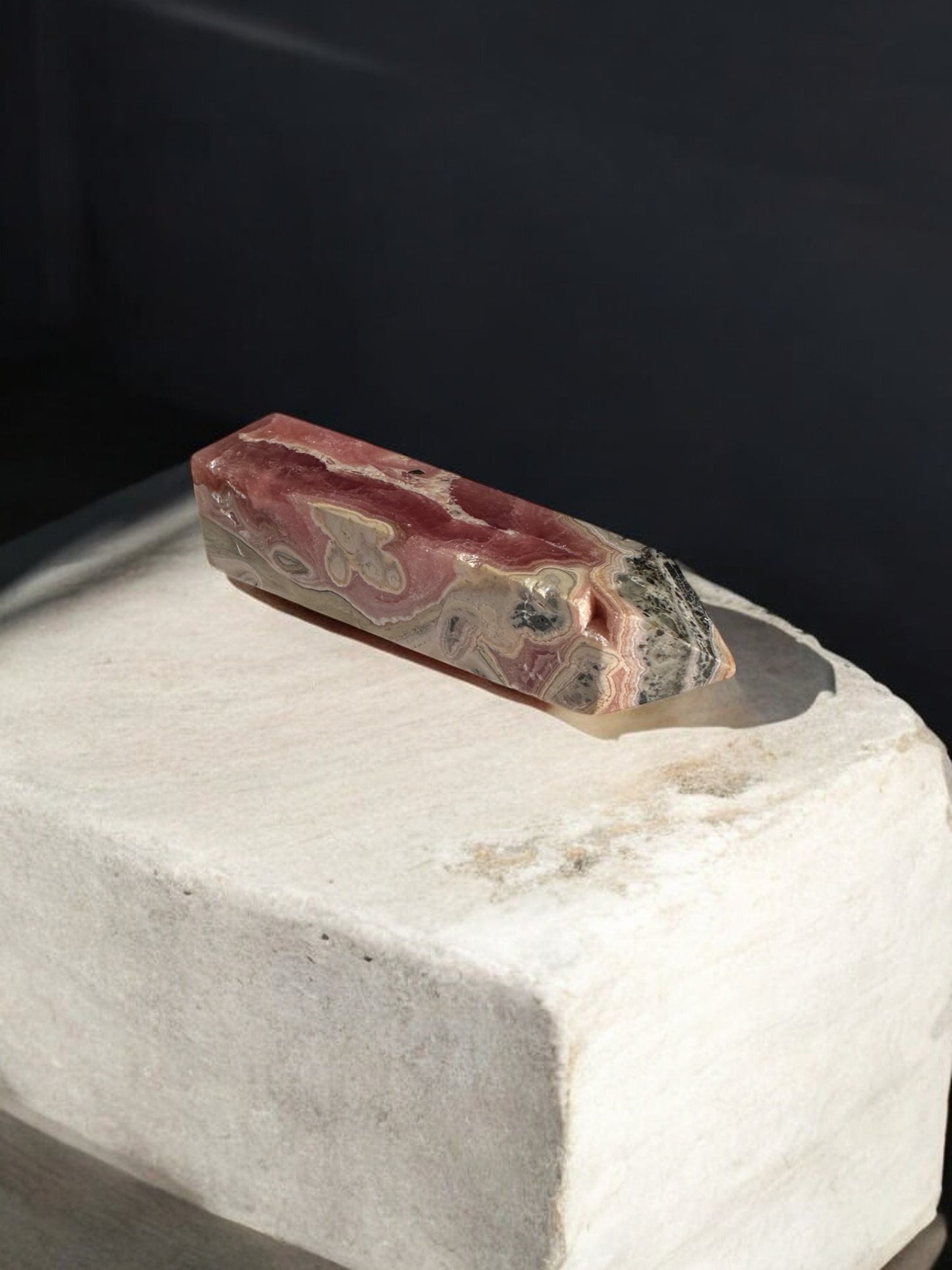 Rhodochrosite crystal point on the slab