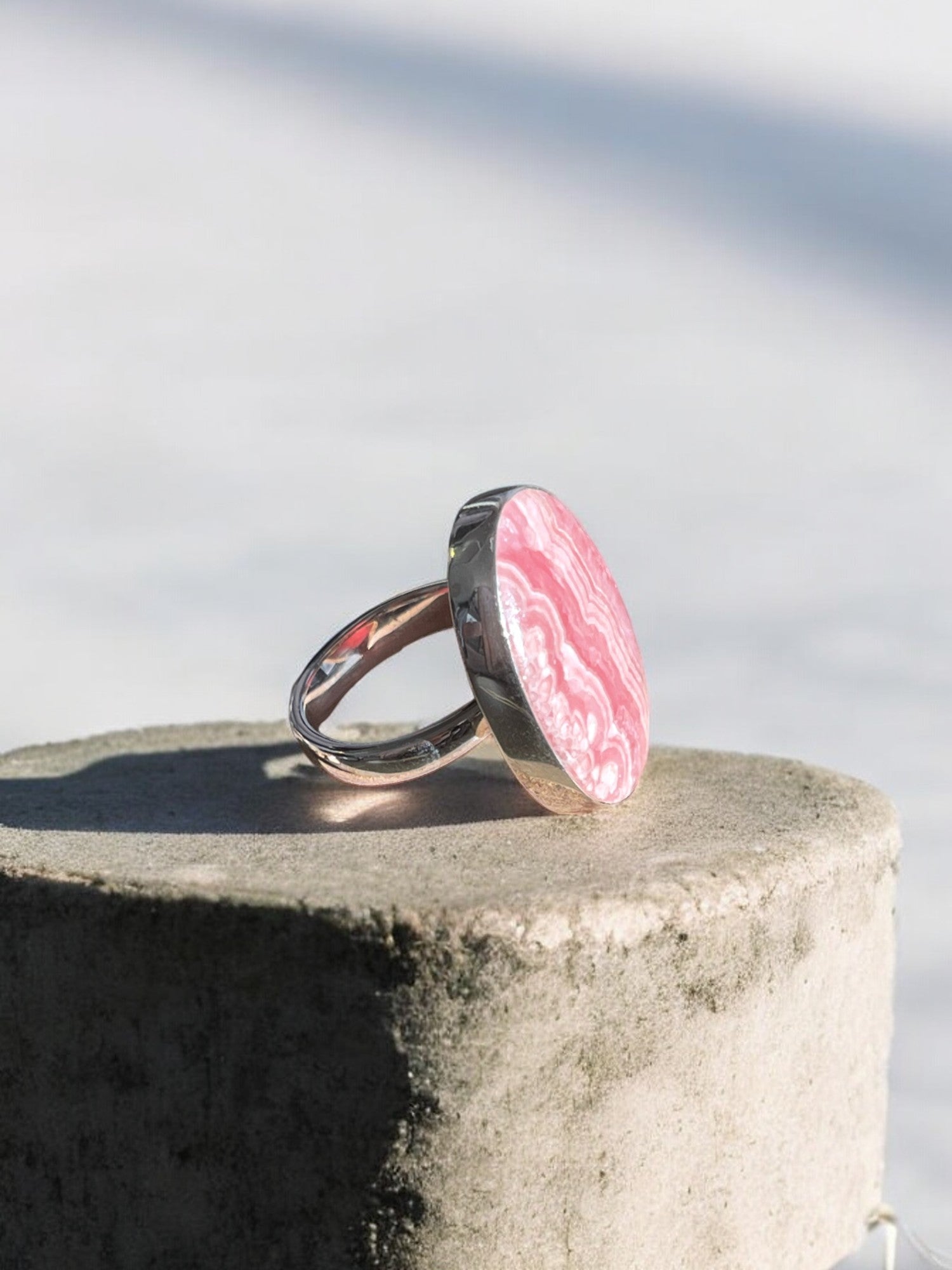 Rhodochrosite crystal ring side view