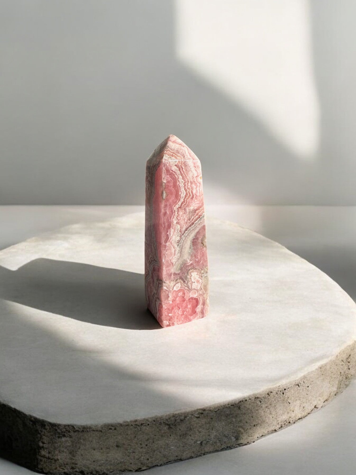 Rhodochrosite crystal tower with flower patterns