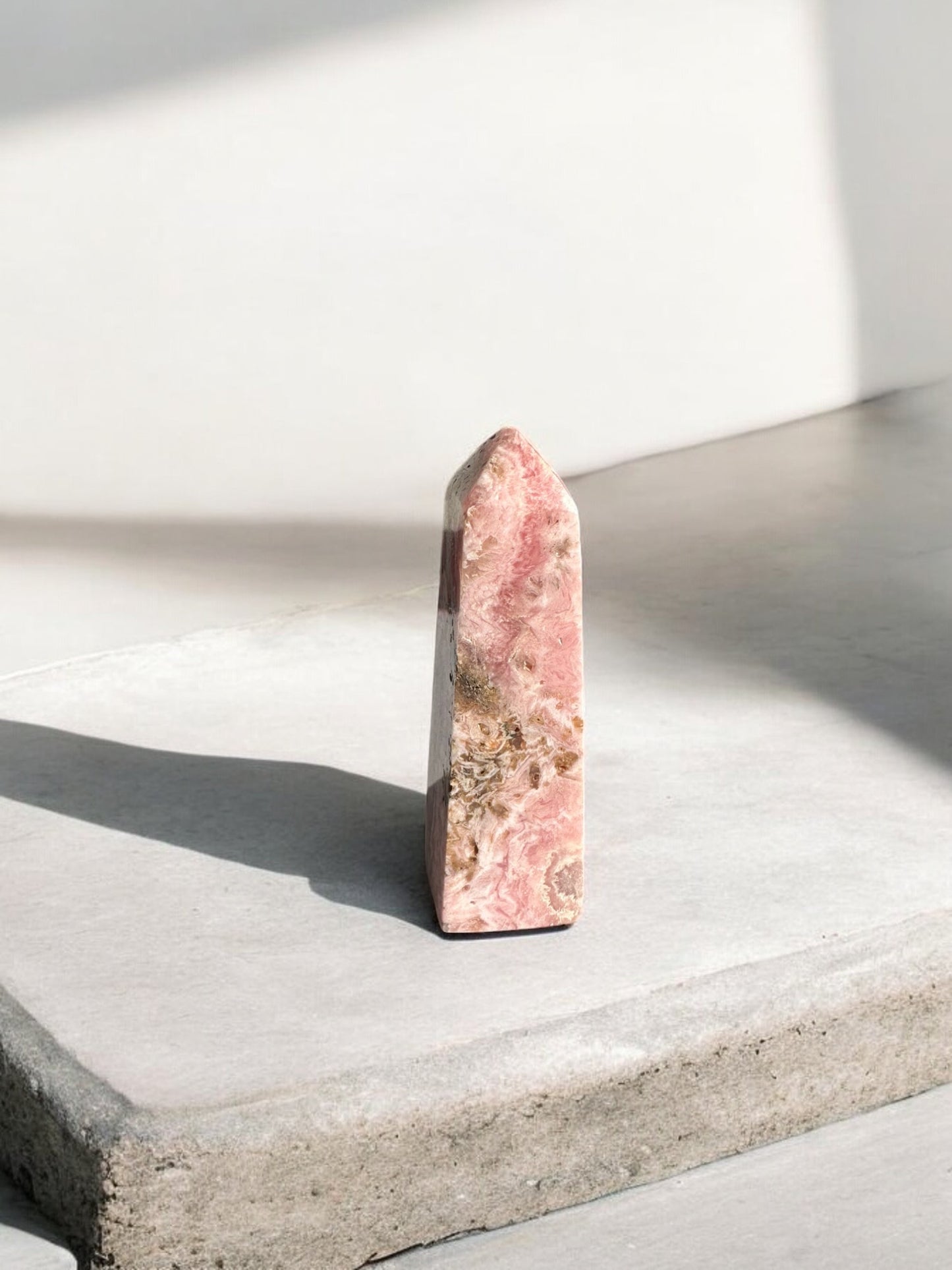 Rhodochrosite crystal tower with lighter colours