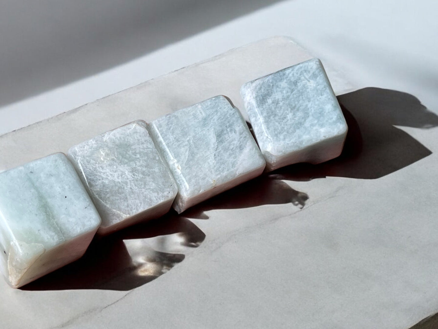 Amazonite crystal cubes on a slab