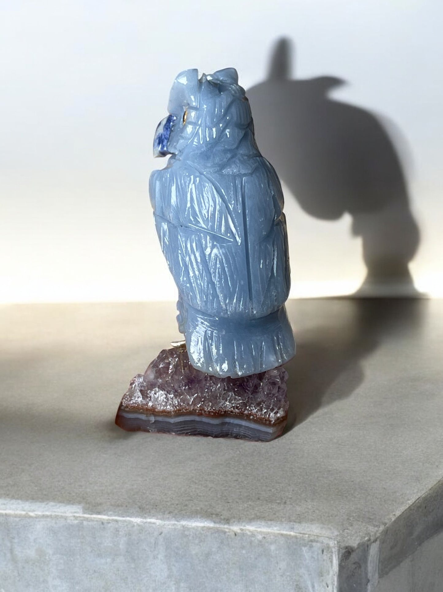 Blue chalcedony owl crystal shape back view