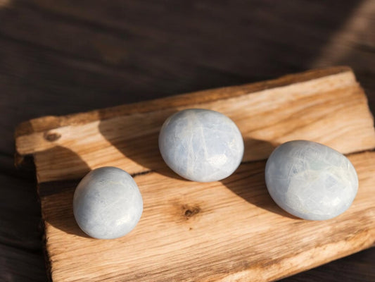 Celestite palm stones on a slab