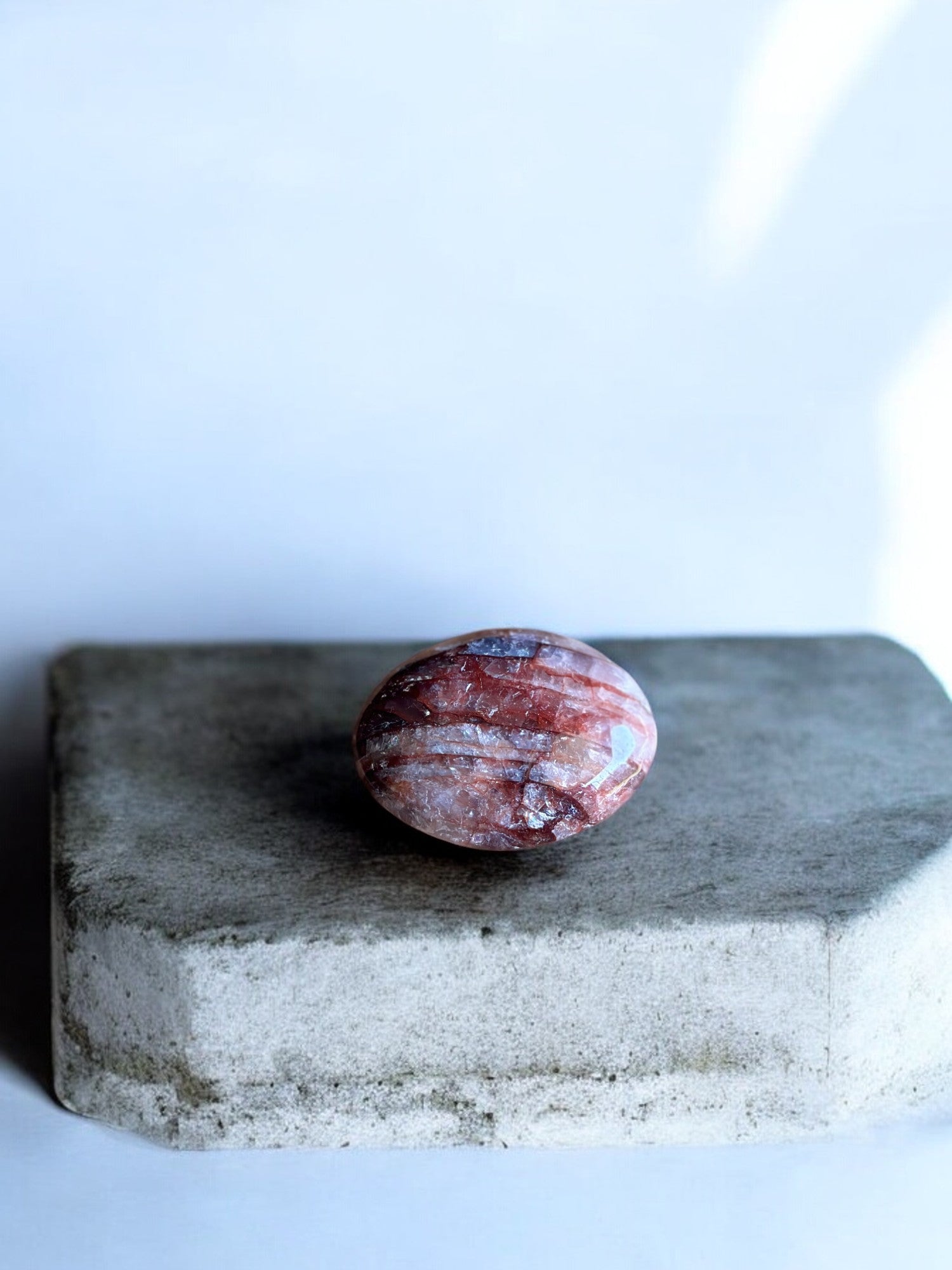 Fire quartz palm stone on a slab