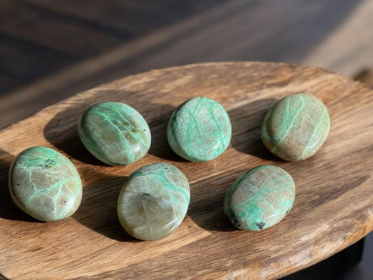 Green moonstone palm stones