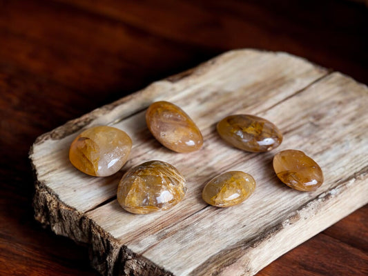 Golden healer palm stones on a slab