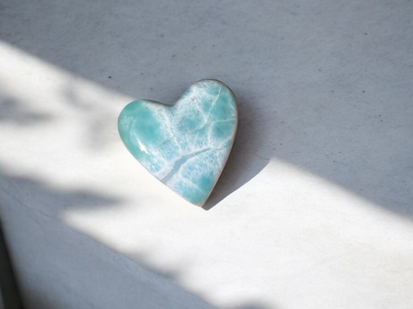 larimar stone crystal heart with darker veins