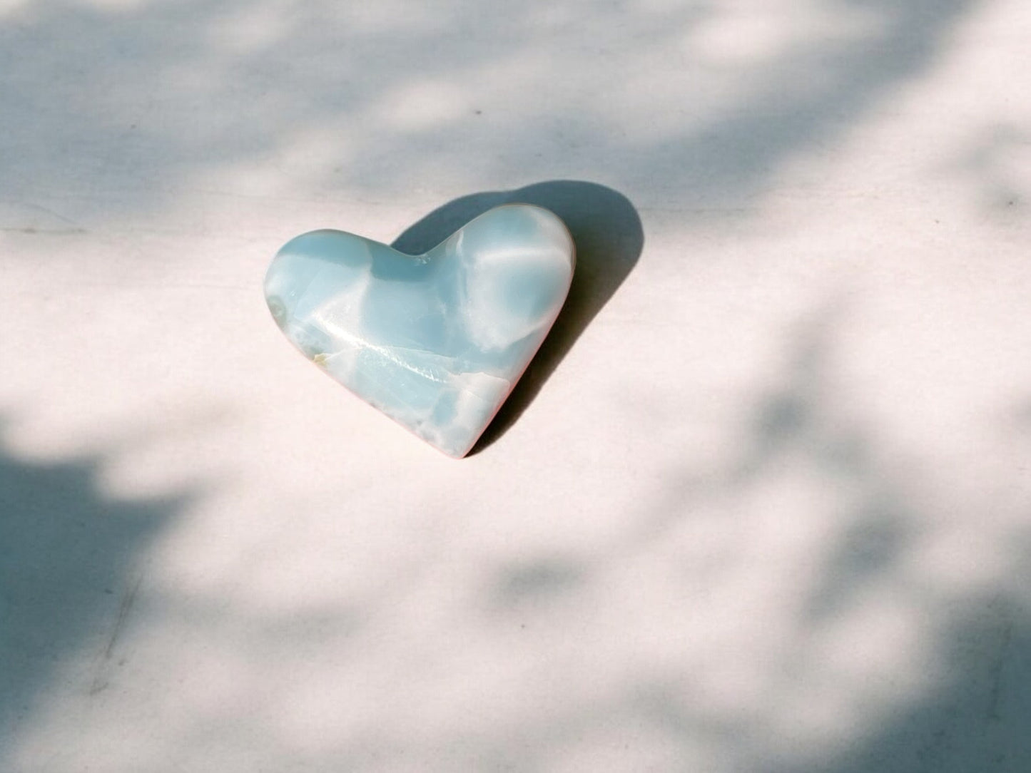 larimar stone crystal heart with inclusions