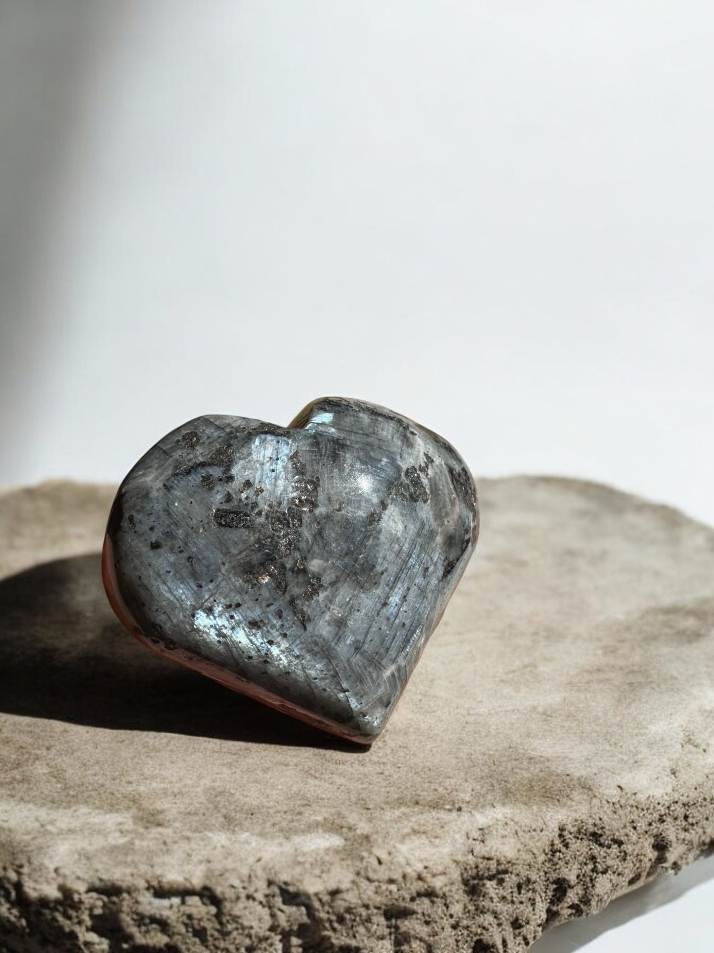 Larvikite crystal heart with strong flash