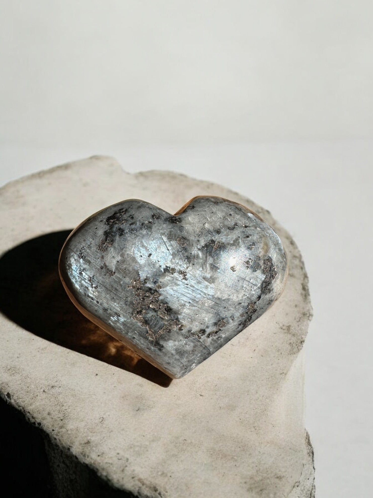 Larvikite crystal heart with flash