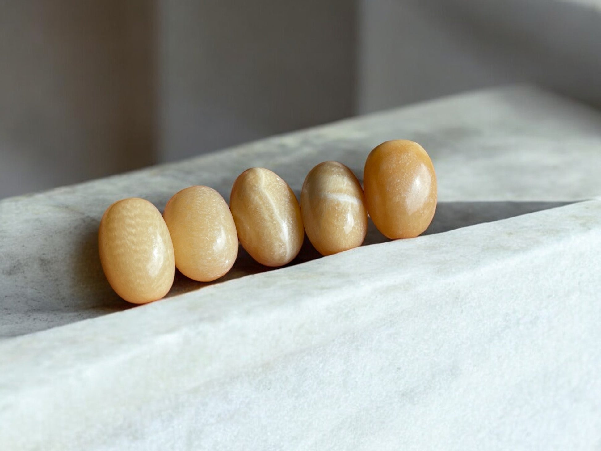 orange calcite tumbled stones