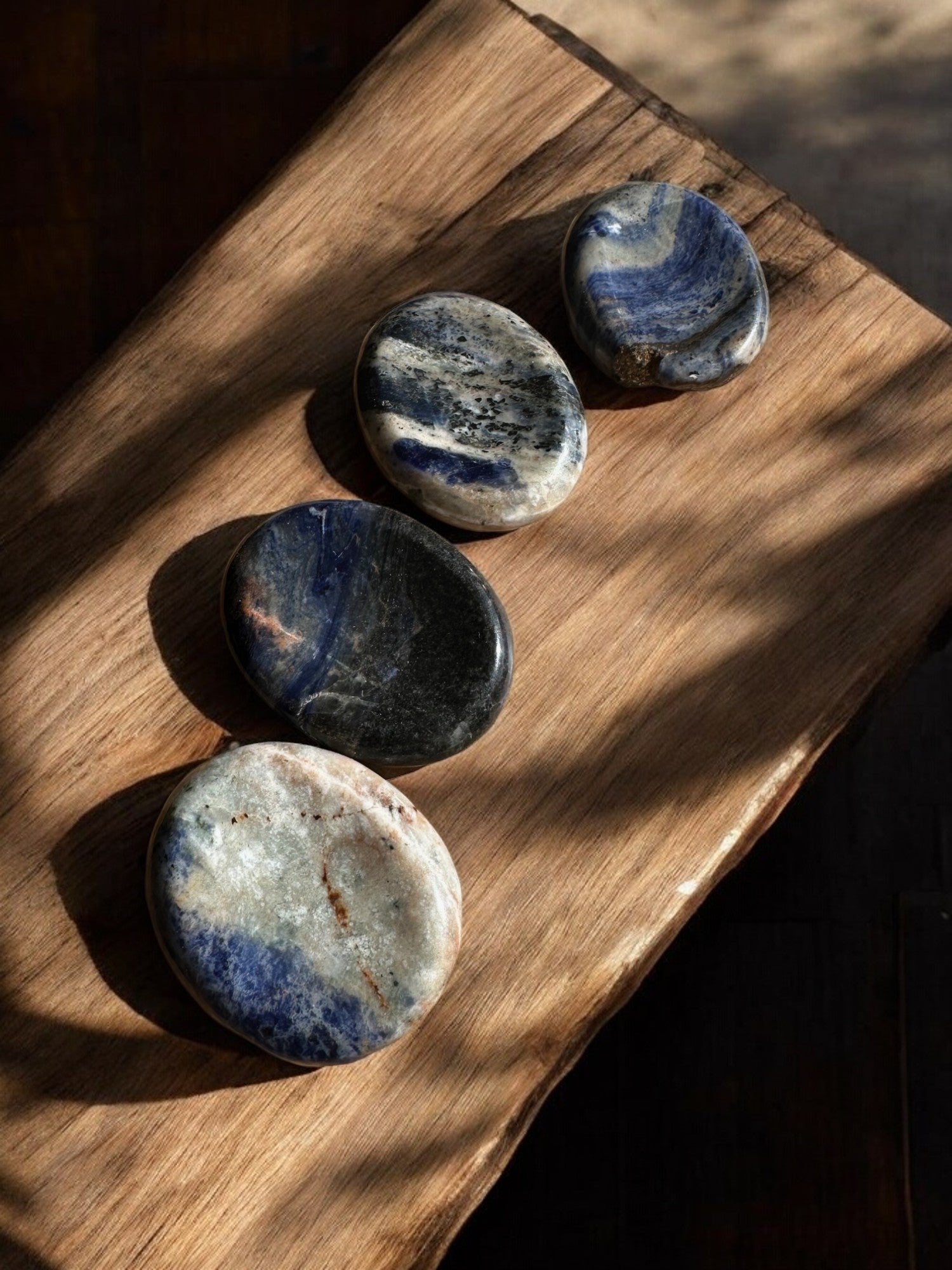 Sodalite worry stones on a slab